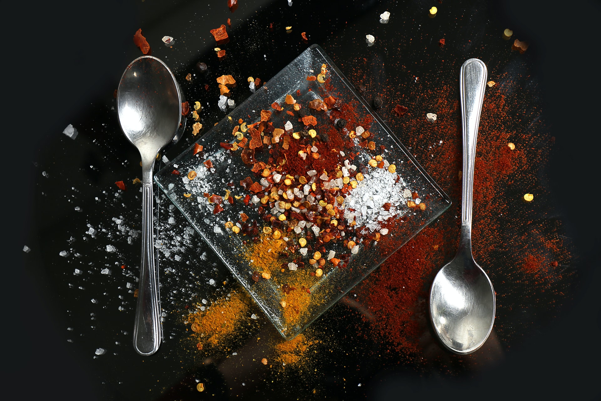 two silver spoons on table